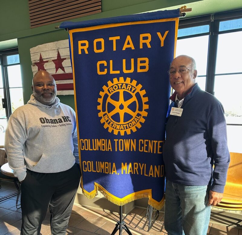 Quinton Askew, Executive Director of OhanaHC, with a community partner at the Rotary Club of Columbia Town Center.