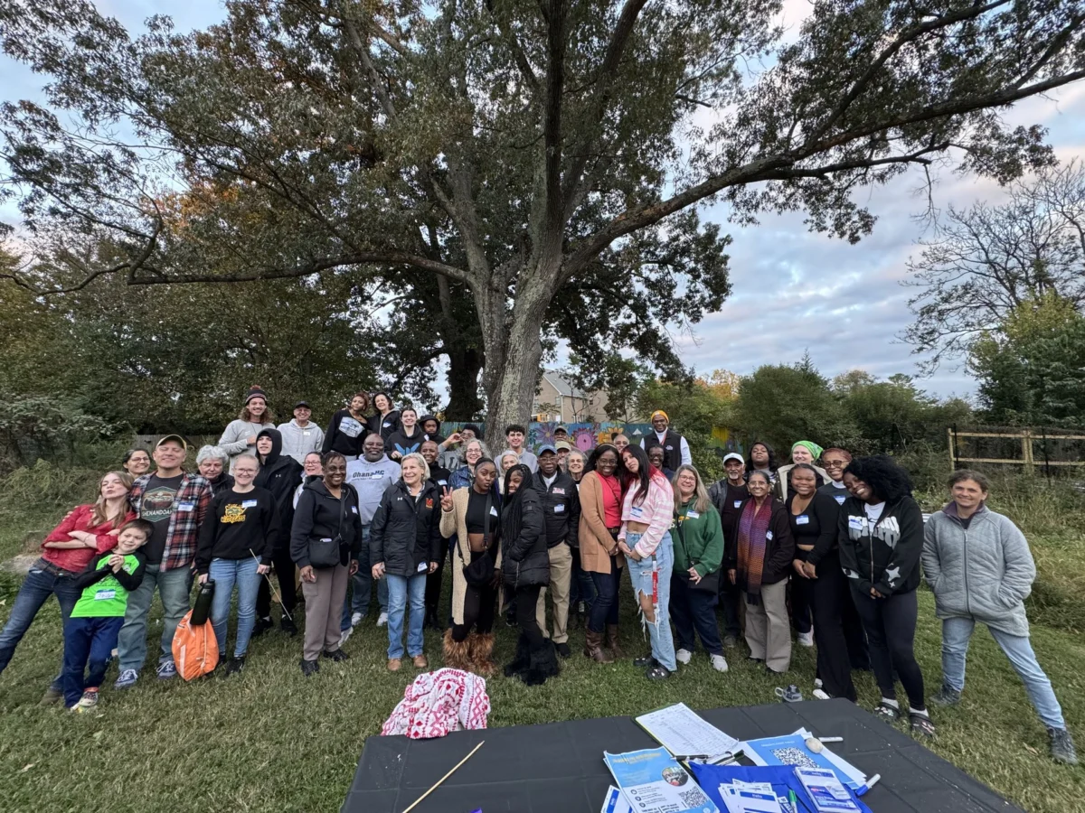 About fifty OhanaHC students, mentors and families gathered under a large tree at the community bonfire