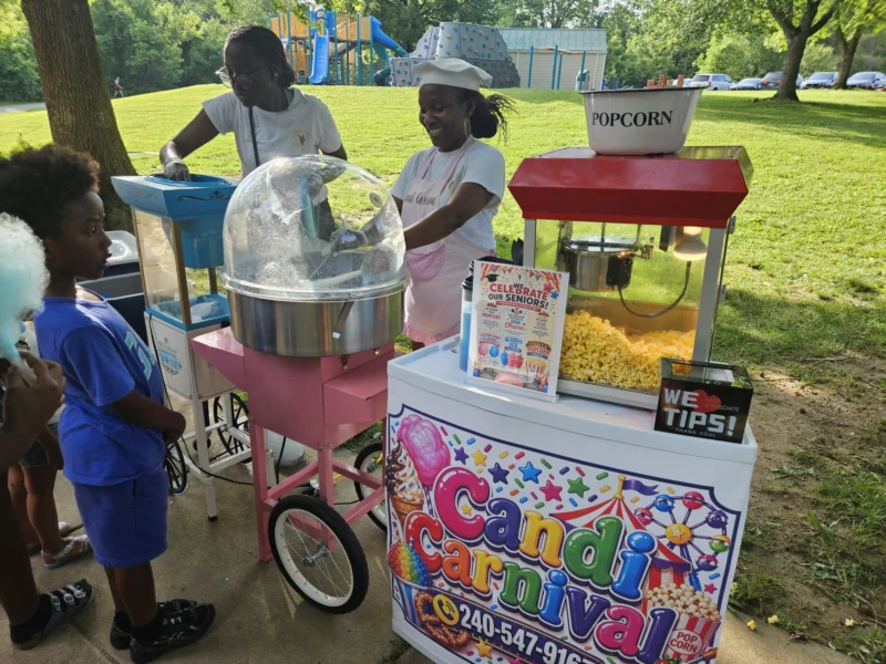 OhanaHC students at the popcorn and cotton candy carts at the 2026 year end celebration