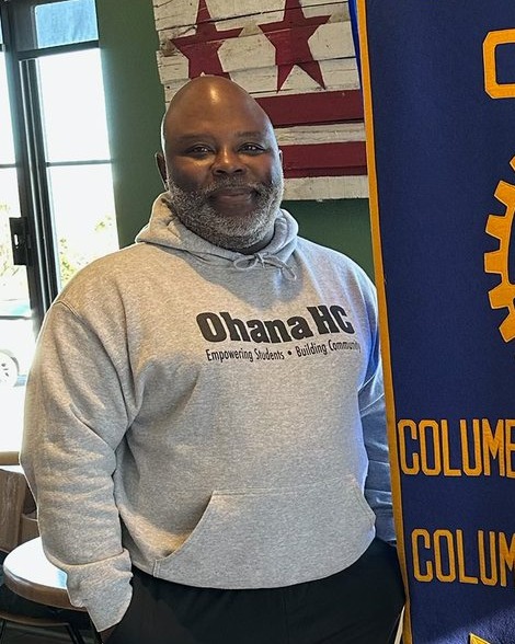 Quinton Askew, Executive Director of OhanaHC, in an OhanaHC sweatshirt