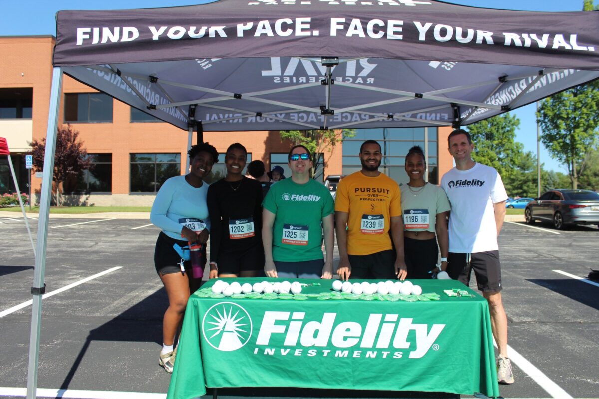 A sponsor team from Fidelity Investments at their table at the Ohana 5K.
