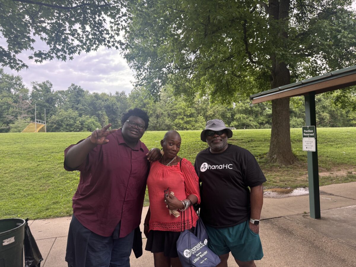Three members of the OhanaHC community smiling together in the park at the 2026 year end celebration