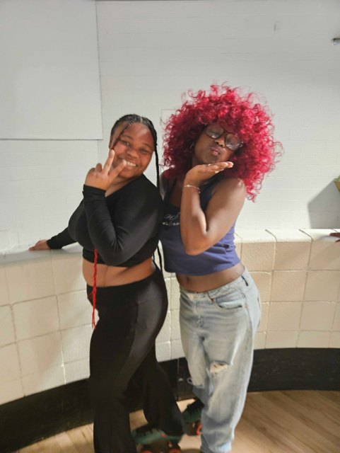 Two OhanaHC friends posing together at the roller skating outing.