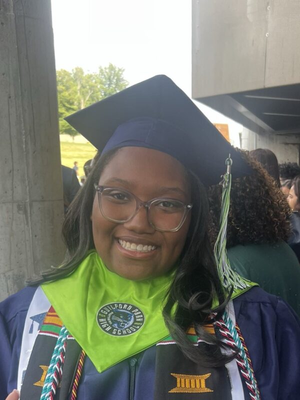 Jada F. smiling in her cap and gown at her Guilford Park High School graduation, ready for Elizabeth City State University.